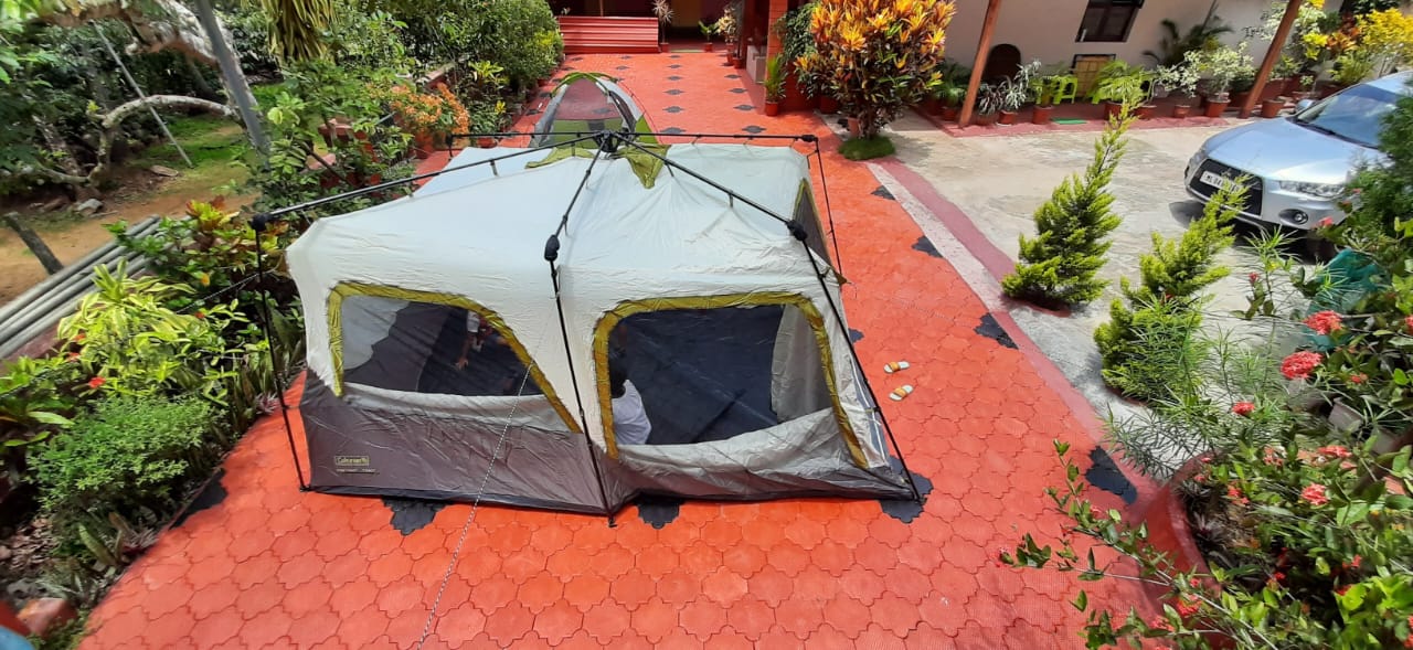 A tent set among the gardens at Whispering Grove
